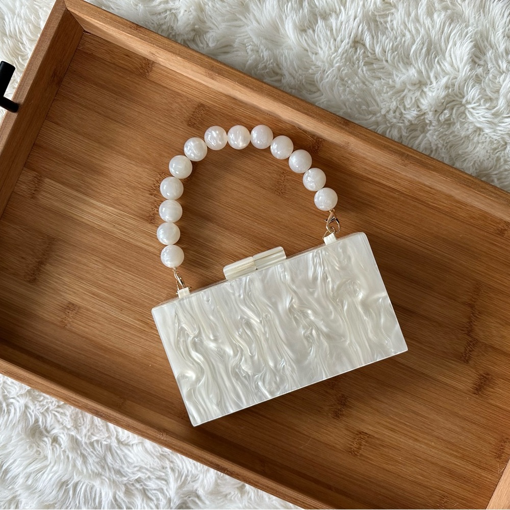 Chic Pearl-Handled White Clutch